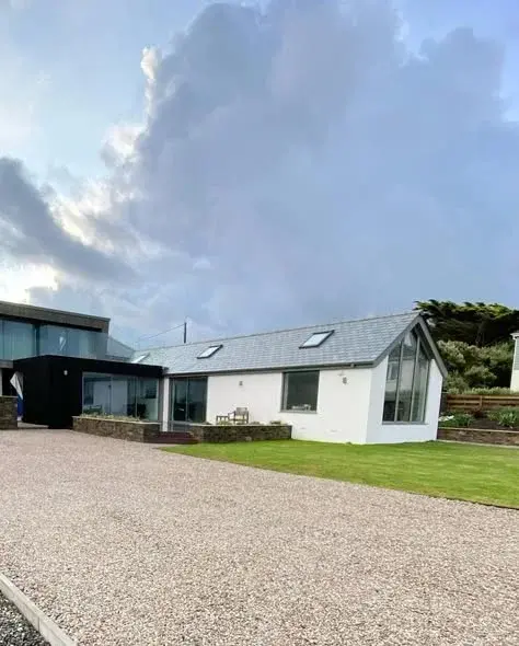 White-rendered coastal home completed by PureRend near Bude, North Cornwall
